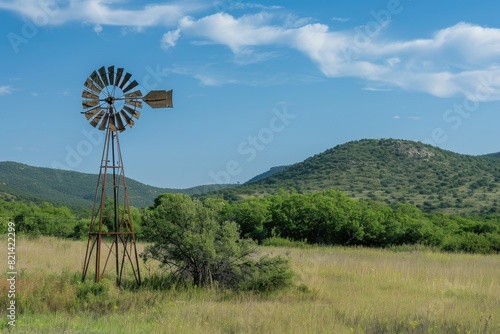 Rustic windmill standing tall in an open field