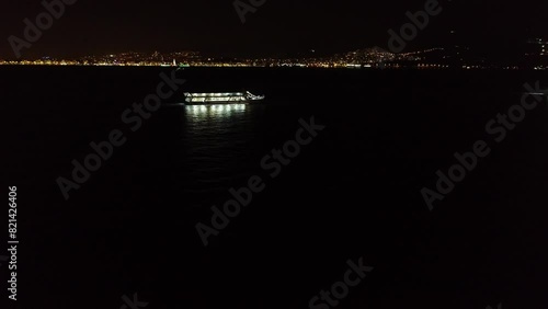 Drone shot of the ferry sailing at night in Izmir photo