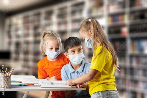 Happy school children preparing for lessons