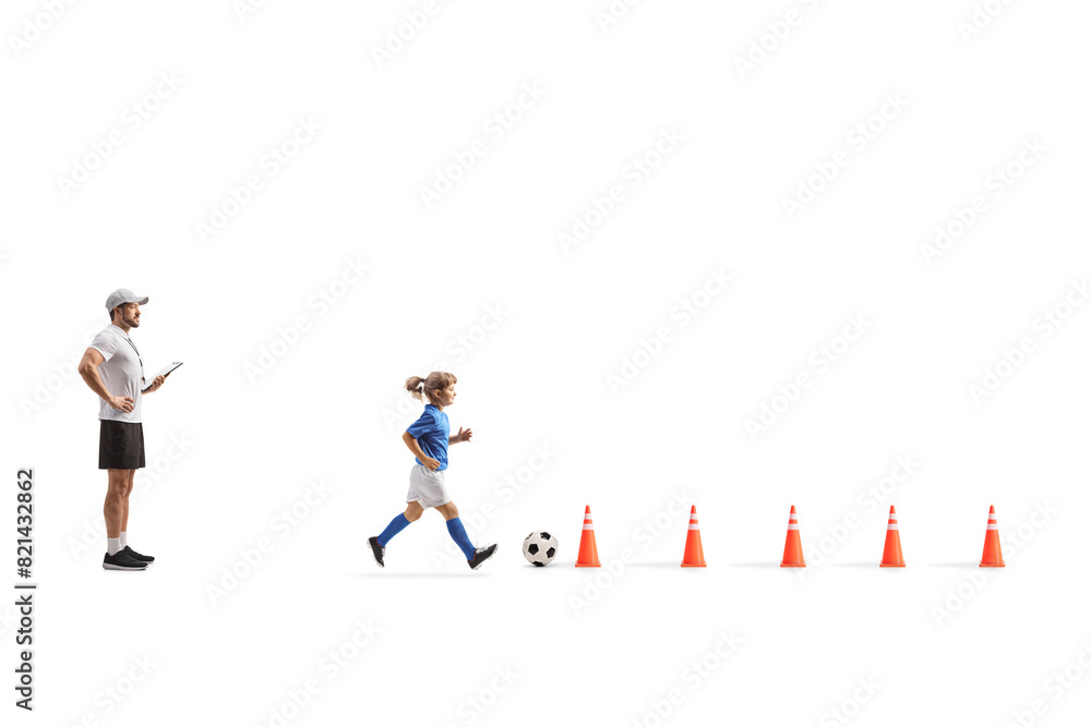 Football coach and running with a ball between obstacles Football coach and running with a ball between obstacles