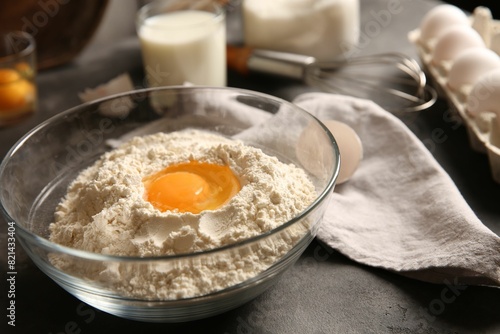Wallpaper Mural Making dough. Flour with egg yolk in bowl on grey table, closeup Torontodigital.ca
