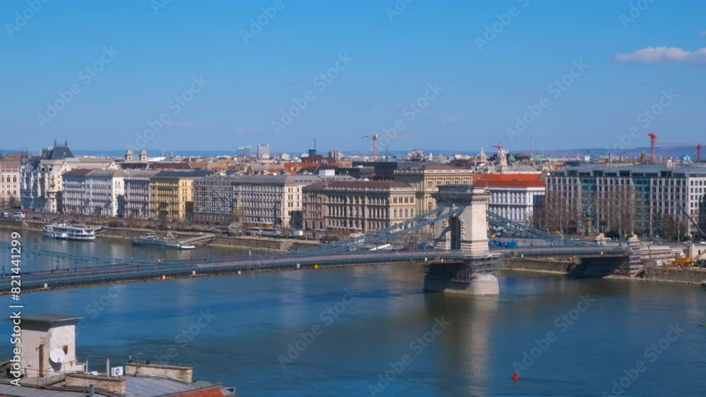 Ancient construction of budapest bridge. A view of ancient Secheni bridge with traffic against public street and famous buildings of Budapest. Ancient construction of budapest bridge. A view of ancient Secheni bridge with traffic against public street and famous buildings of Budapest.