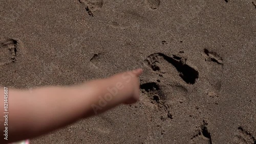 Footprints in the Sand: Little Girl's Journey Along the Portuguese Shoreline