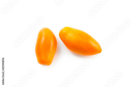 Two yellow tomatoes isolated on white background with clipping path. .