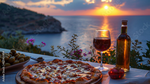 Pepperoni pizza and red wine on a table overlooking the ocean during a vibrant sunset, creating a perfect evening.