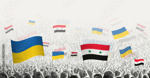 People waving flag of Syria and Ukraine, symbolizing Syria solidarity for Ukraine.
