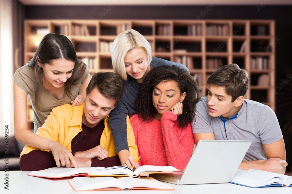 Diverse group of classmates studying project Diverse group of classmates studying project