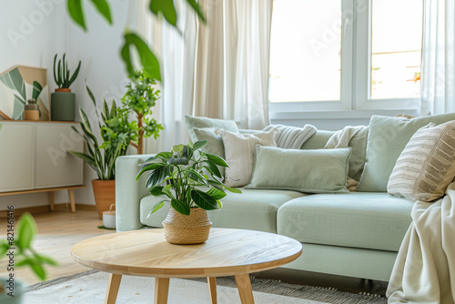 Living Room Interior Design in White and Green in Scandinavian style. Home decor, sofa, house plants, furniture © Juli Soho