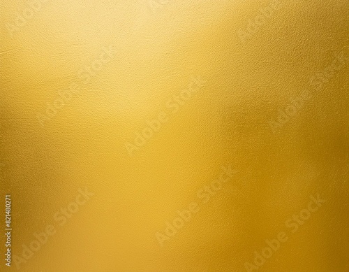 gold wall texture background yellow shiny gold foil paint on wall surface with light reflection