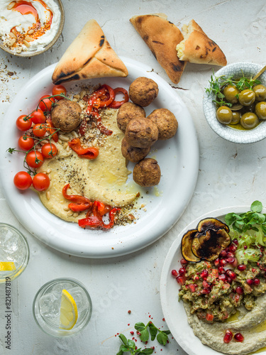 Middle Eatern Meze with breads, olives and hummus photo