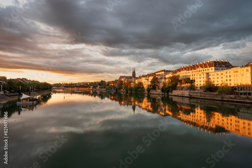 Sunrise over the Rhine in Basel Switzerland with cityscape reflection in the water