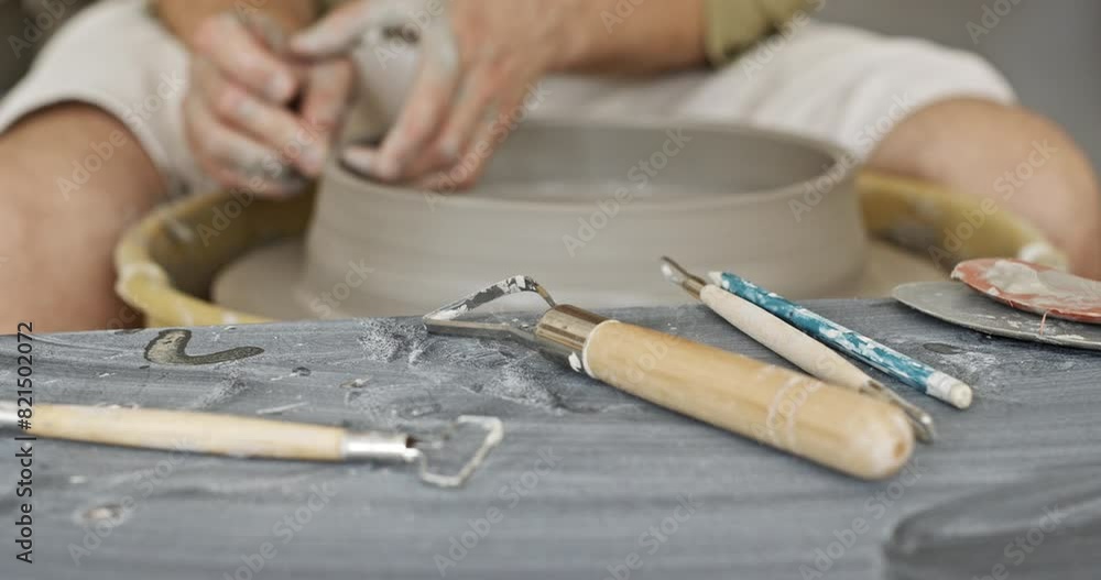 Man Shaping Clay on Pottery Wheel in Artisan Workshop Man Shaping Clay on Pottery Wheel in Artisan Workshop