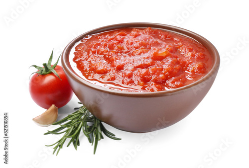 Homemade tomato sauce in bowl and fresh ingredients isolated on white