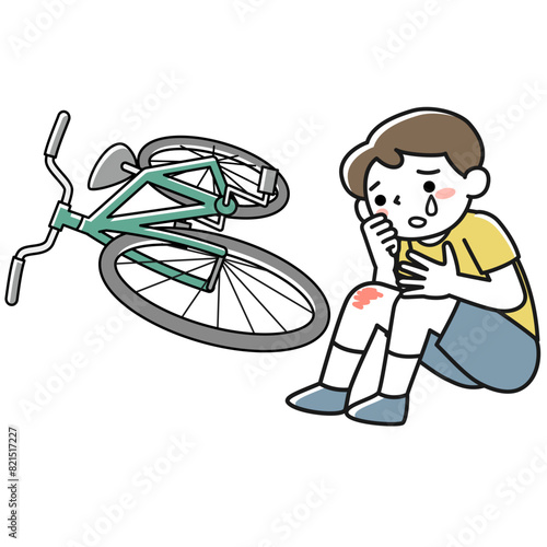 自転車で転んで泣いている男の子