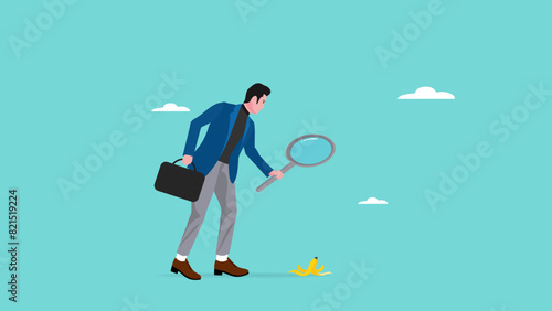 identify dangers in business or economic disasters, Analyze the company's financial health before investing, businessman using a magnifying glass to observe the dangers of banana peels on the road