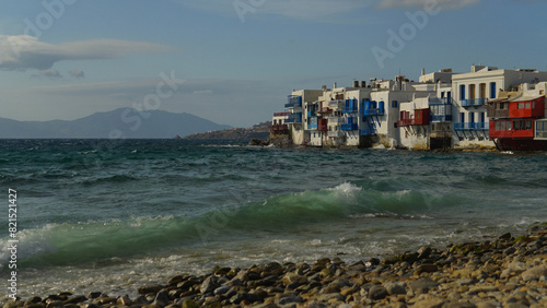 Colorful buildings along the ocean in Mykonos, Greece photo