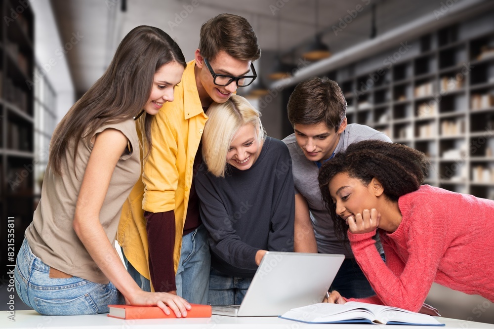 Fototapeta premium Happy young students team in library