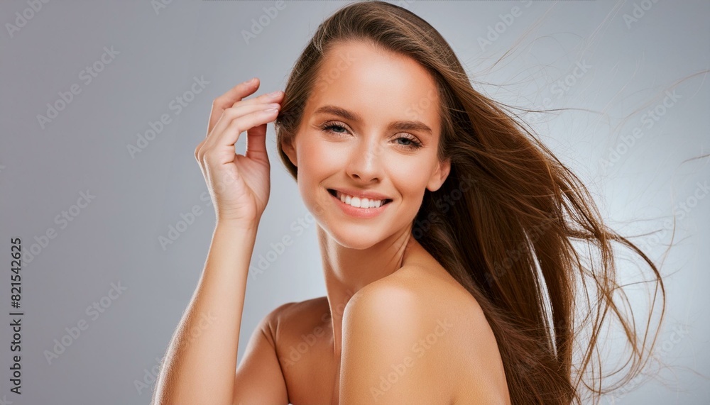 Nourished hair feels so amazing. young woman posing against a grey background. Nourished hair feels so amazing. young woman posing against a grey background.