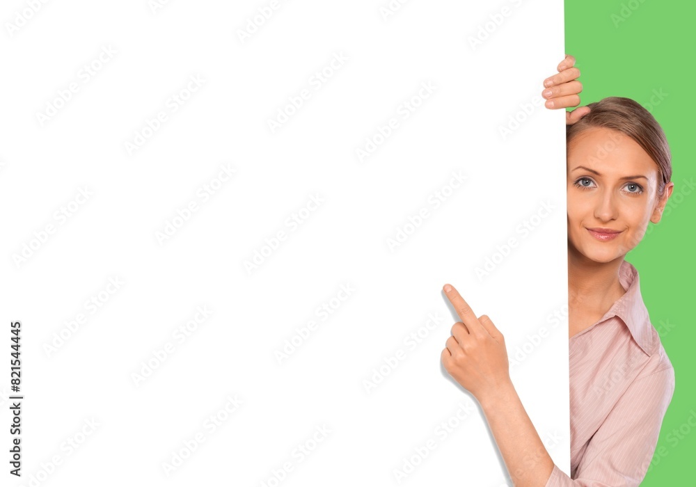 Photo of young girl pointing finger to empty space Photo of young girl pointing finger to empty space