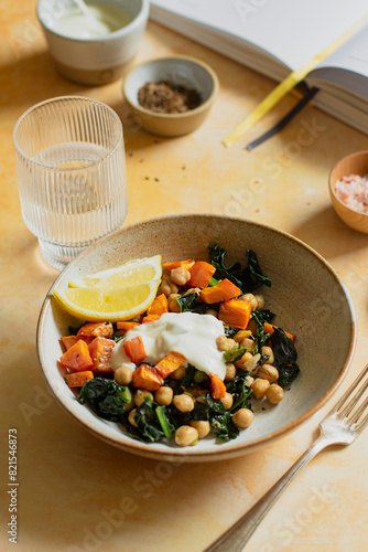 Cavolo nero and chickpea salad on a yellow background photo