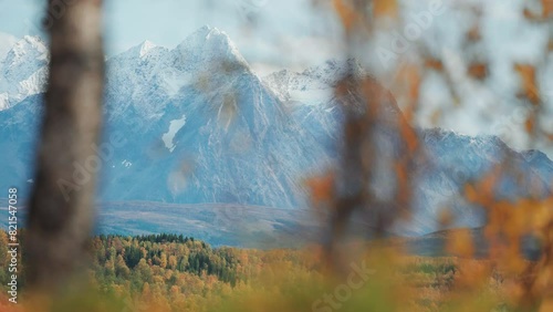 The snow-capped mountain range of Lyngen Alps in northern Norway. Colourful autumn landscape at the foot of the mountains. parallax video. photo