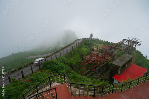 Monsoon clouds passing over Gidda Pahar, view point, Kurseong, Himalayan mountains of Darjeeling, West Bengal, India. Darjeeling is queen of hills and very scenic with green hills in rainy season. photo