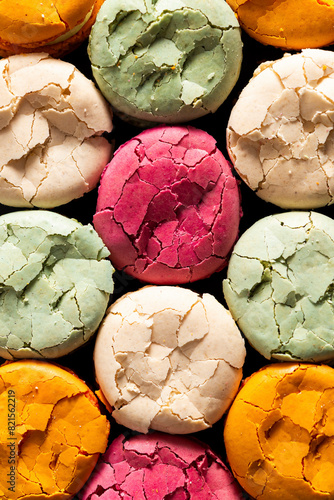 Closeup of multi coloured cracked macarons photo