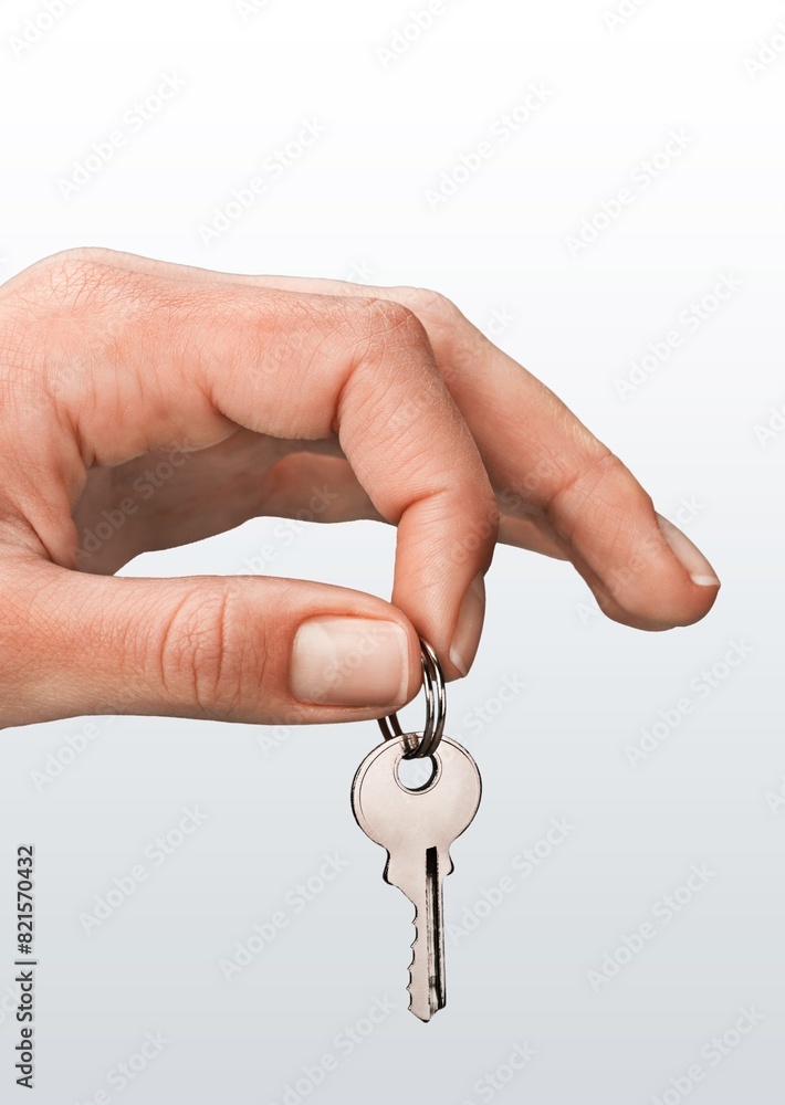 The hand holds steel key, real estate