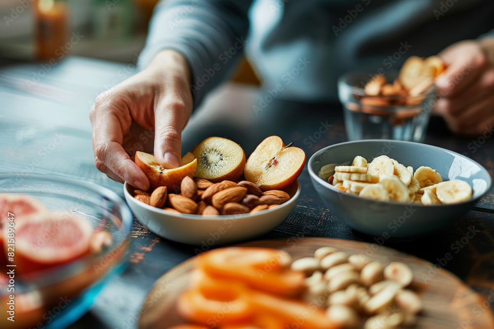 A person is holding a bowl of nuts and fruit, healthy snack A person is holding a bowl of nuts and fruit, healthy snack