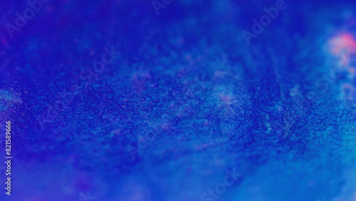 Wet glitter shimmering texture. Defocused blue pink color sparkling particles paint wave flow abstract art background.