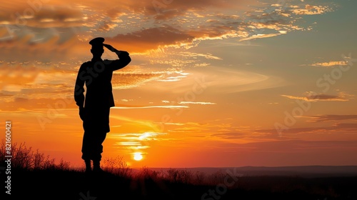 Silhouette of a soldier saluting photo