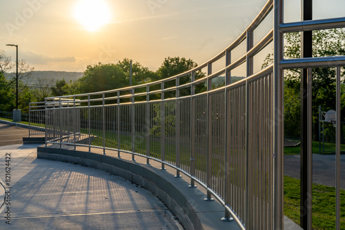 Example of a stainless steel railing along an exterior set of stairs at a public, commercial building. photo