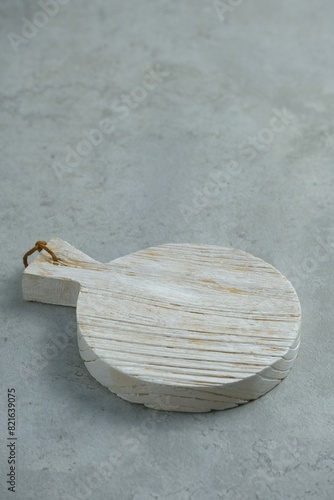 Isolated Rustic wooden cutting board or chopping board on gray background. For design and kitchen concept. Telenan photo