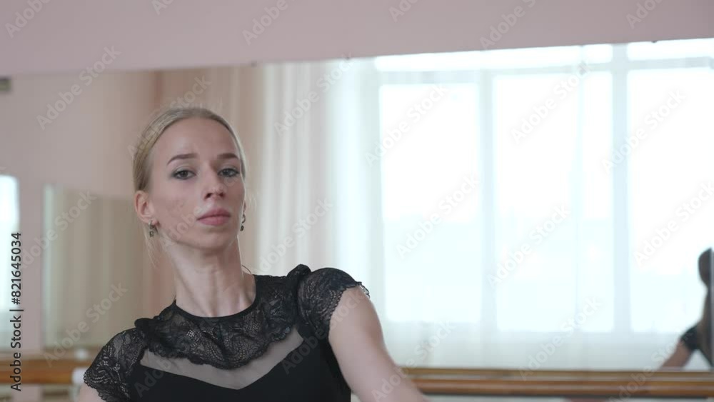 Caucasian blonde woman is practicing ballet in class. Caucasian blonde woman is practicing ballet in class.