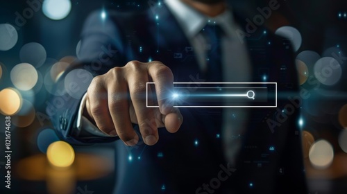 The photo shows a man in a suit touching a glowing search bar icon. The background is blurred with a bokeh effect...A businessman searching for information on the internet.