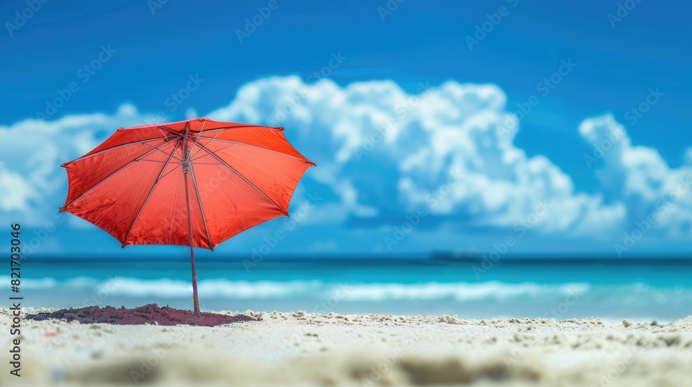 A vibrant beach umbrella provides shade on the sandy shore overlooking the sparkling ocean, with people enjoying the coastal natural landscape under a clear sky AIG50