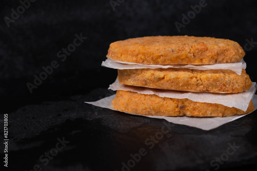 Wallpaper Mural Frozen fish cutlets on dark black background, semi-finished, ready for cooking. Convenience and homemade frozen healthy meals. Torontodigital.ca