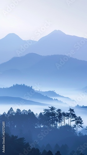 Hazy mountain landscape in morning mist © AwieDarwis
