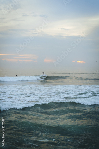 Man surfing at sunset, Bali, Canggu.