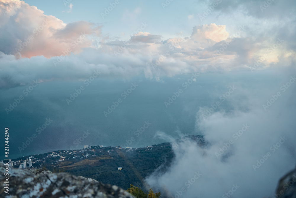 Sweeping Aerial View of Clouds and Water Below, Perfect for Travel and Adventure Websites