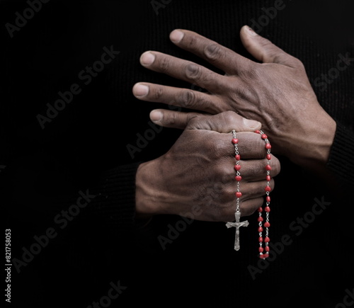 praying to God with hands together with  on black background with people stock image stock photo	