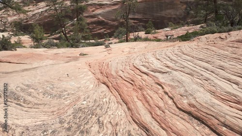 Panning view of the sandstone patterns and texture in the Utah desert in the Zion wilderness. photo