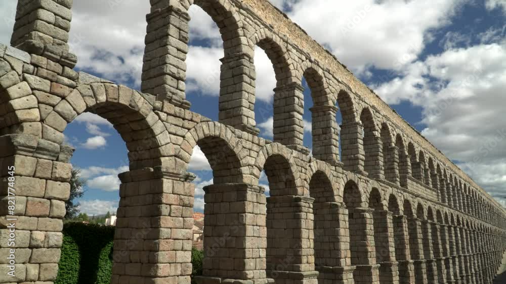 Ancient Roman aqueduct on Plaza del Azoguejo square and old building towns in Segovia, Spain Ancient Roman aqueduct on Plaza del Azoguejo square and old building towns in Segovia, Spain