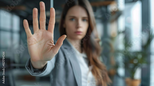 Stop, hand sign and woman with no gesture for sexual harassment and violence in workplace. Business professional