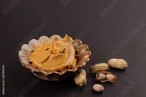 Creamy and Smooth Peanut Butter with Peanuts. photo