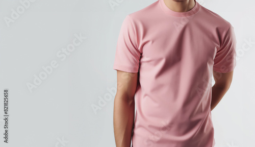 Man Wearing Pink T-Shirt on White Background with Soft Lighting, Mockup