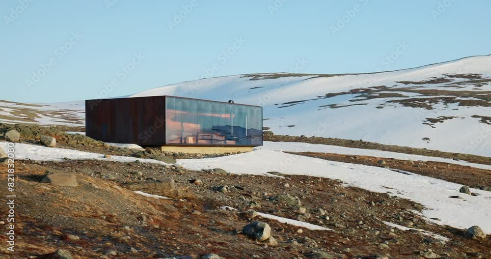 Slide motion reveal iconic Snøhetta viewpoint in snowy landscape and sunset glow Slide motion reveal iconic Snøhetta viewpoint in snowy landscape and sunset glow