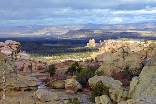 looking out from the sandstone bluffs overlooks at lava fields in el malpais national monument, near grants,  in northern new mexico
