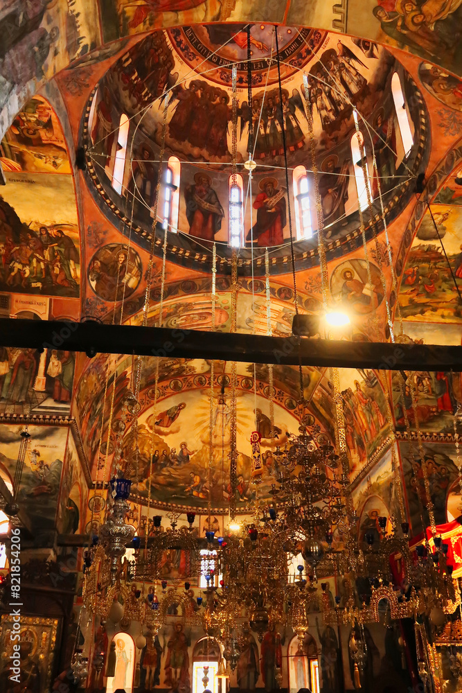Obraz premium Inside the Church St., Saint Archangels Michael and Gabriel at the Bachkovo Monastery, colorful frescos, ceiling, wall paintings and golden chandeliers, close to Plovdiv, Bulgaria
