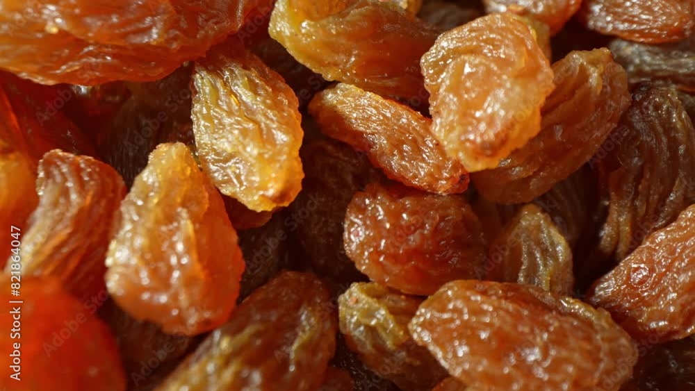 A close-up captures the intricate world of green raisins, their surface a mosaic of amber and brown, lit up to unveil their natural, translucent beauty.
A close-up captures the intricate world of green raisins, their surface a mosaic of amber and brown, lit up to unveil their natural, translucent beauty.